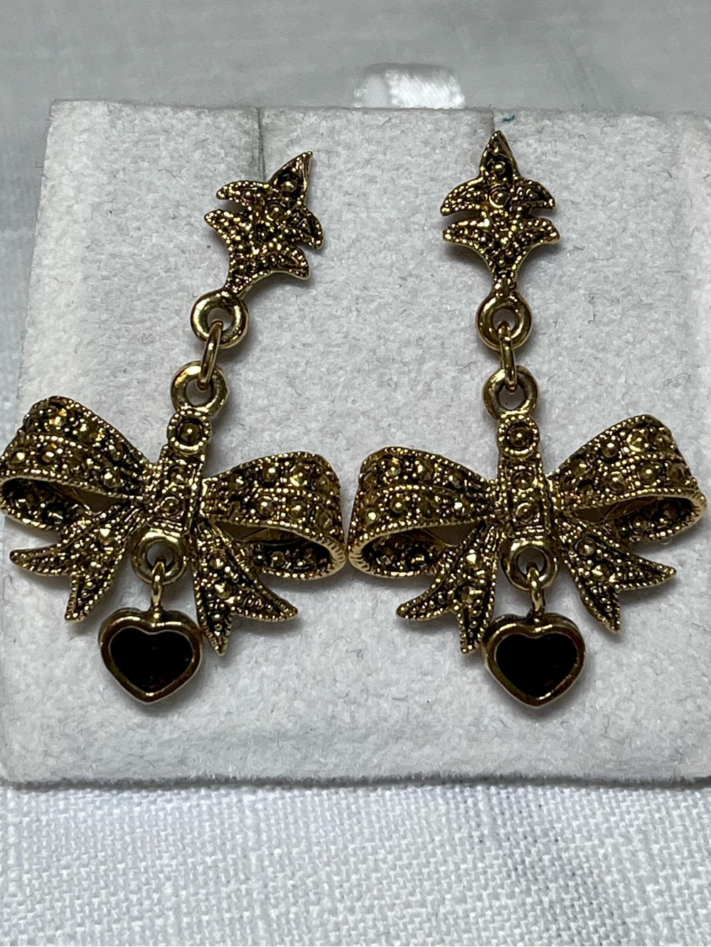 Vintage Gold Bow Earrings with Black Heart Drops
Unique